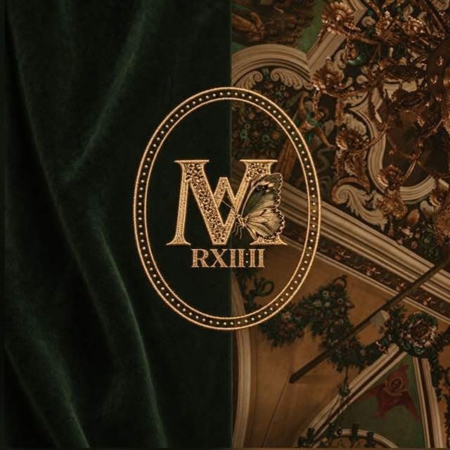 Metanoia emblem in gold on deep green velvet